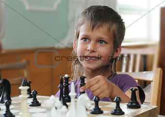 Girl plays chess