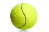 close-up shot yellow tennis ball on a white background