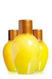 yellow bottles with cosmetics on the white background