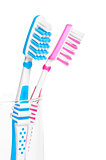 pink and blue brush stand in a glass