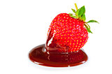 A chocolate-dipped strawberry on a white background
