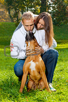 Happy Young Couple with Dog