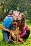 Happy Young Couple with Dog