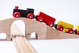 wooden toy train on bridge