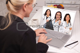 Woman Using Laptop Viewing Three Doctors with Thumbs Up