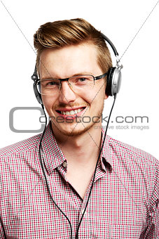 Listens and smiles with headphones