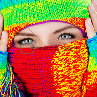 Close up on covered face with blue eyes