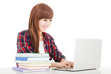 smiling young student girl with book and laptop isolated on whit