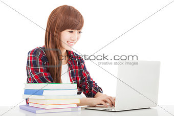 smiling young student girl with book and laptop isolated on whit