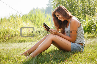 teenage girl using tablet pc