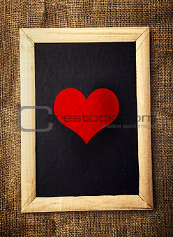 Heart on black board