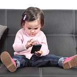 Cute baby browsing in a smartphone