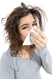 Close up of a woman with flu and  a handkerchief in the nose