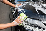 hands hold sponge  for washing car