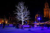 Ice-skating people at the night in Christmas ice-rink, Maastrich