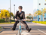 businessman riding bicycle to office for eco-friendly