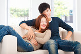 happy Couple in sofa  at home 