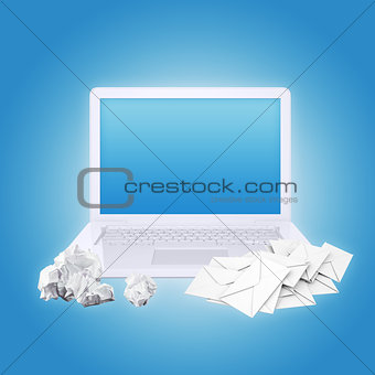 Laptop crumpled paper and envelopes