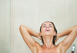 Young woman washing in shower