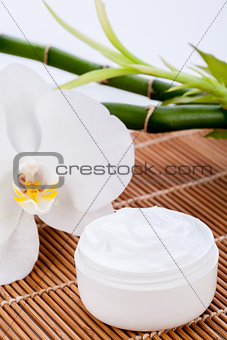 cosmetic face cream on wooden background 