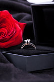red rose and diamond ring in a box 