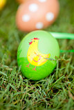 colored easter eggs group in green grass outdoor in spring