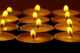 Tea lights candles with fire