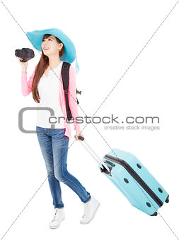young woman holding  traveling case and camera