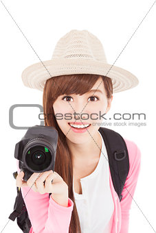 smiling young woman holding a  camera