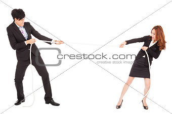 businessman and woman playing tug of  war