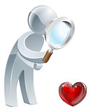 Heart magnifying glass man