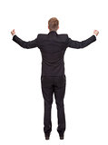 Businessman celebrating with raised arms