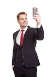Handsome businessman taking a selfie 