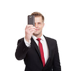 Handsome businessman taking a selfie