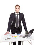 Businessman standing behind the office desk