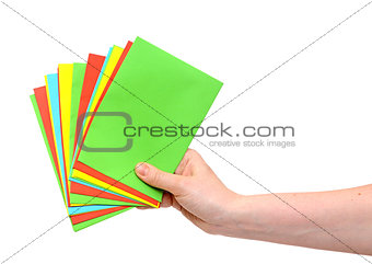 woman hand holding pile colorful envelopes isolated on white