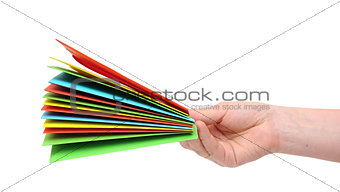 woman hand holding pile colorful envelopes isolated on white