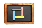 Set of colorful chalk on blackboard 