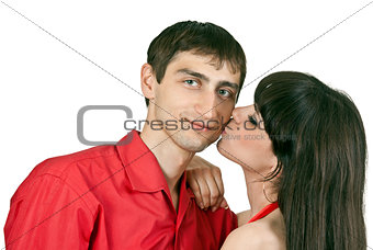 woman kisses a man on the cheek