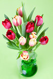 Red and yellow tulips in a vase