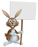 Easter bunny holding sign
