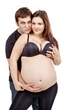 loving happy couple, pregnant woman with her husband, isolated o