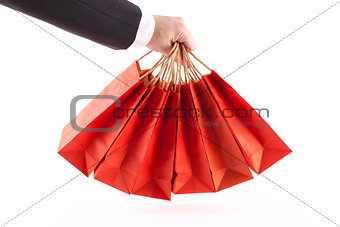 Man holding red shopping bags