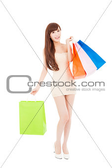 smiling and  lovely asian woman with shopping bags