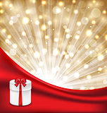 Gift box with red bow on glowing background