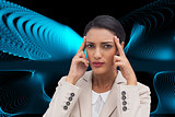 Composite image of young businesswoman putting her fingers on her temples