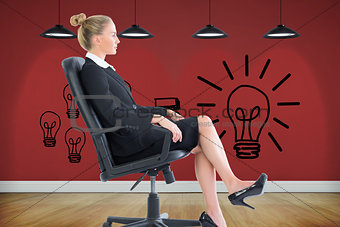 Composite image of businesswoman sitting on swivel chair in black suit