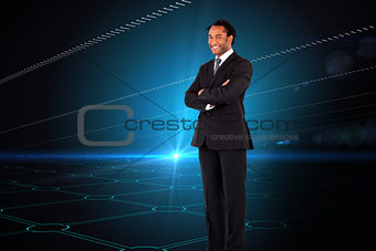 Composite image of businessman with folded arms