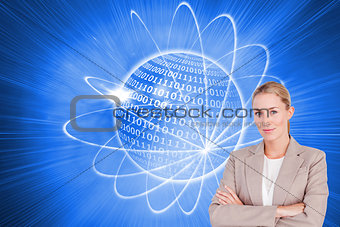 Composite image of confident female executive with folded arms
