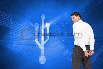 Composite image of businessman wearing handcuffs